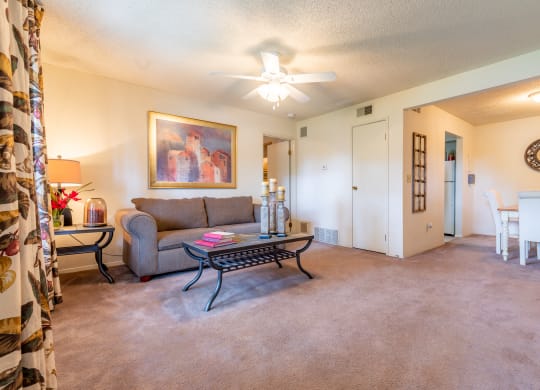 1 Bedroom Living Room with couch and coffee table at Bristol Pointe Apartments, Olathe, Kansas