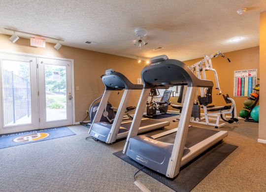 fitness center with treadmills at Bristol Pointe Apartments, Olathe, Kansas