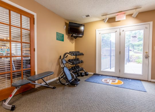 fitness center with free weights  at Bristol Pointe Apartments, Olathe, Kansas