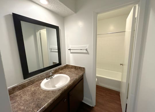 Classic Studio - Bathroom with a sink and mirror.