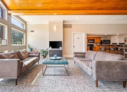 Resident lounge with comfortable seating and access to clubhouse amenities.