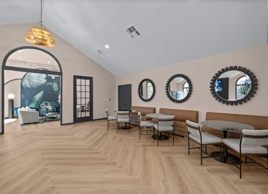 A room with a white sofa and a wooden floor.