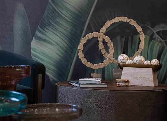 A table with a bowl of eggs and a stack of books.