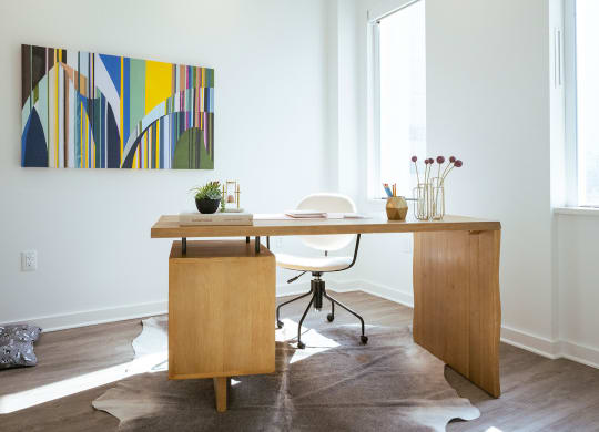 bedroom in b1 floorplan staged as an office at Sky on Main in MO