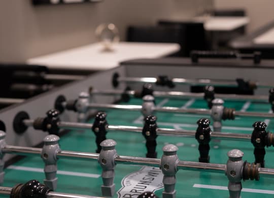 foosball table in game room at Sky on Main in Missouri, 64105