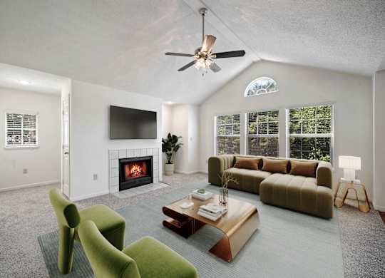 Living room with fireplace, vaulted ceiling, and large windows at Stonebriar Apartments