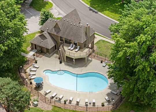 A house with a pool in the backyard.