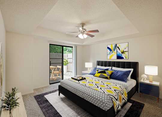 A bedroom with a bed, nightstand, and a ceiling fan.