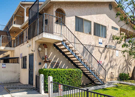 A building with a staircase leading to the second floor.