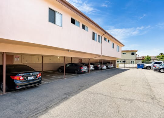 A parking garage with cars parked in it.