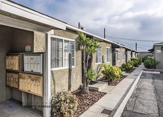 A row of houses with a sign that says