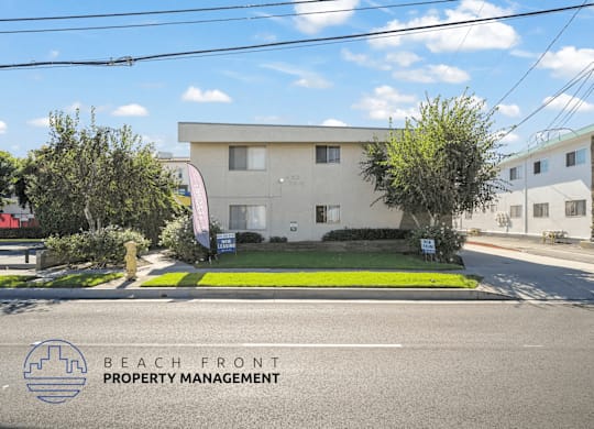 A building with a sign that says Beach Front Property Management.