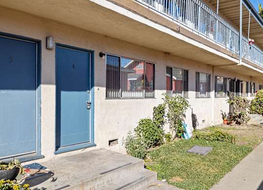 A building with blue doors numbered 4 and 5.