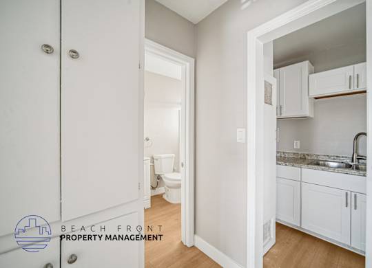 A white bathroom with a toilet and sink.