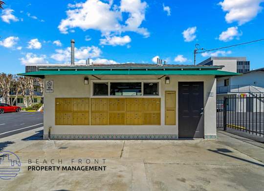 the front of a building with a parking lot
