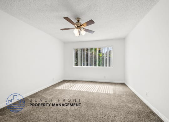 view of large bedroom with natural light and ceiling fan
