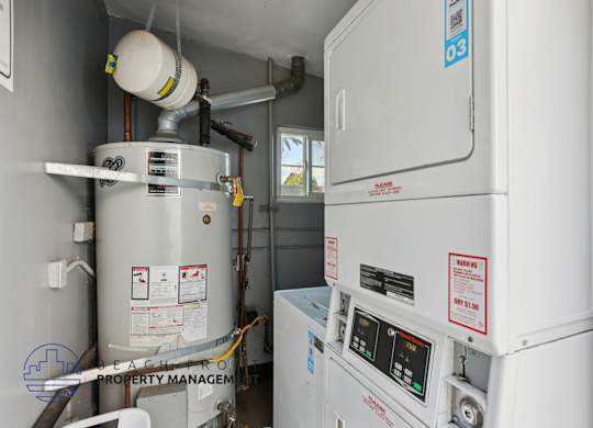 A water heater and a tankless water heater are installed in a room.