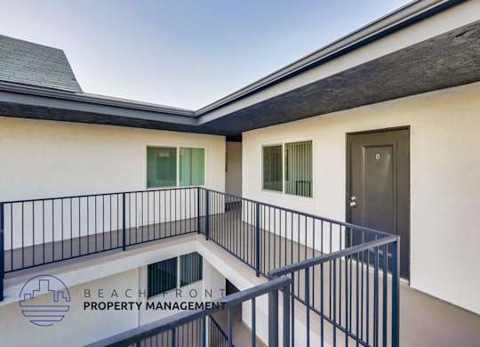 a view of a balcony of a building with a door