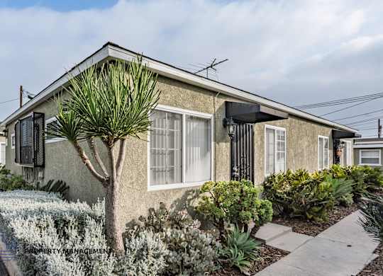 A house with a garden in front.