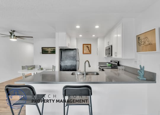a kitchen with a counter top and a sink