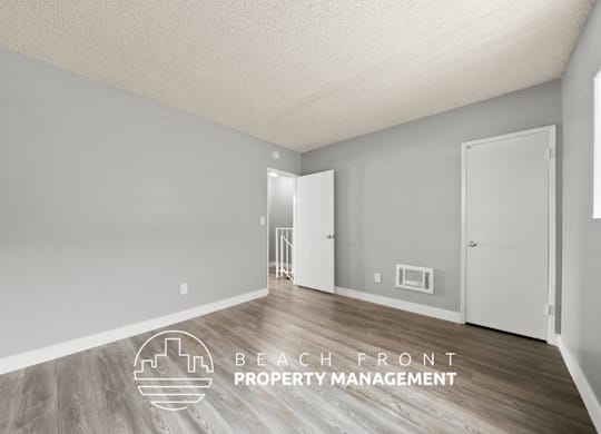 A room with a logo for Beach Front Property Management.