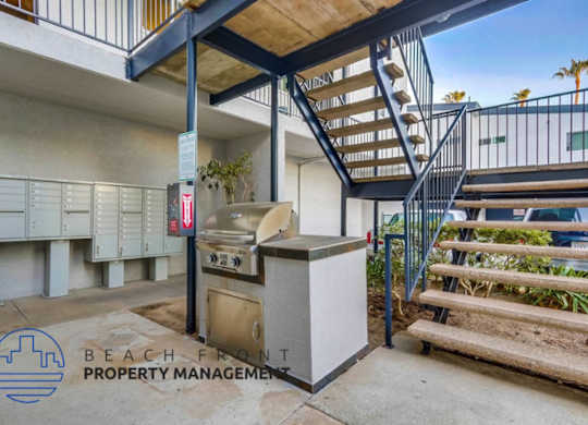 A bbq grill is in the middle of a patio area.