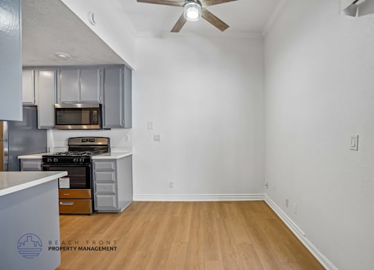 A kitchen with a stove top oven and microwave.