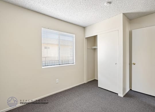 A room with a window and a door is shown.
