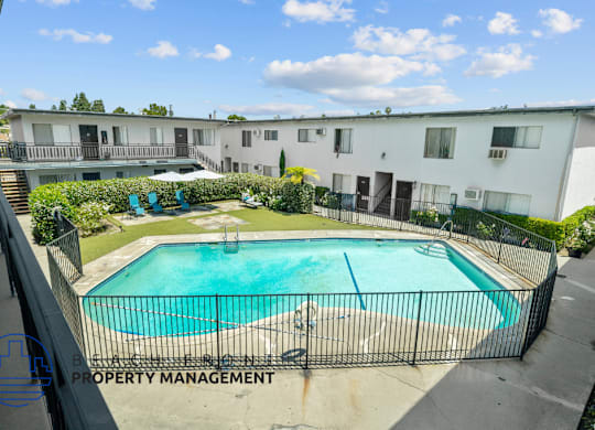 a view of a swimming pool in front of a building