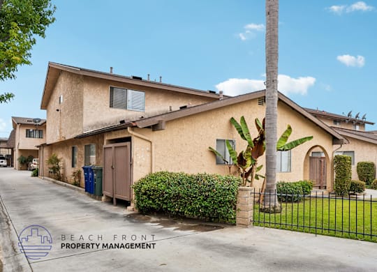 A house with a sign that says Beach Front Property Management.