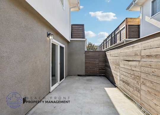 A modern outdoor staircase with wooden steps and railings.