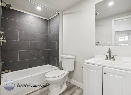 A bathroom with a white toilet and sink.