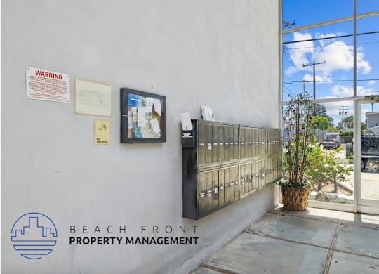 the entrance to the beach front property management office at the front of the building