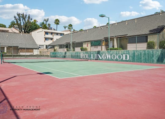 A red tennis court with the words