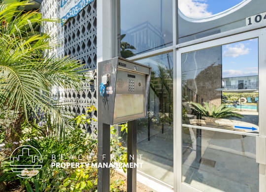 a parking meter in front of a glass door
