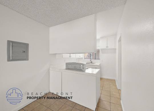 A small white bathroom with a sink and a toilet.
