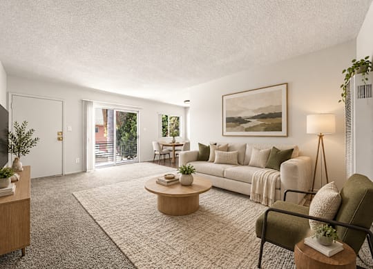 A living room with a couch, coffee table, and a painting on the wall.