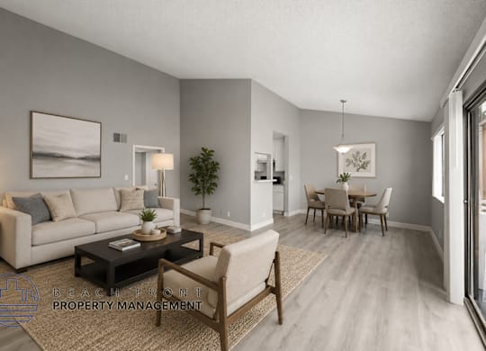 A living room with a couch, coffee table, and chairs.