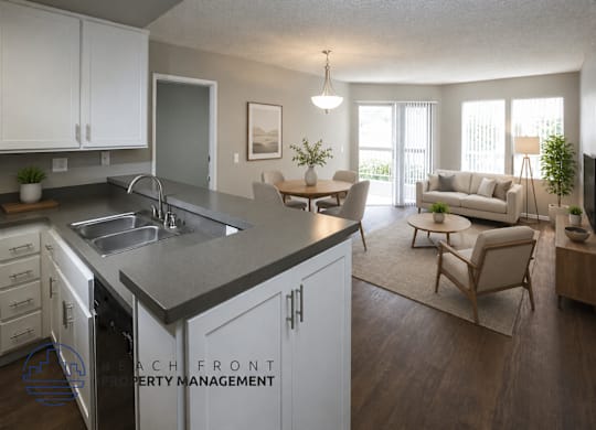 A modern kitchen with a dining area and a living room.