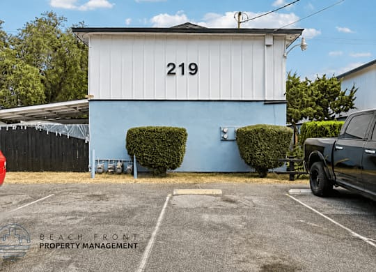 A white building with the number 219 on it.
