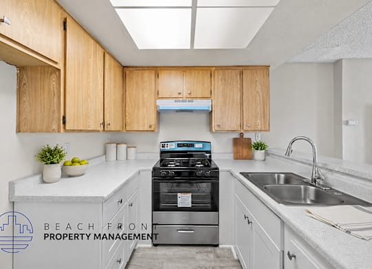 A kitchen with wooden cabinets and a stove top oven.