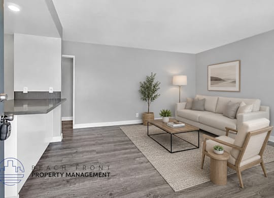 A living room with a couch, chair, and coffee table.