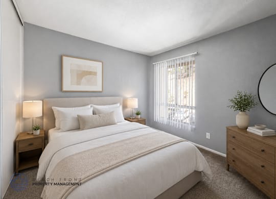 A bedroom with a large bed, two nightstands, and a round mirror on the wall.