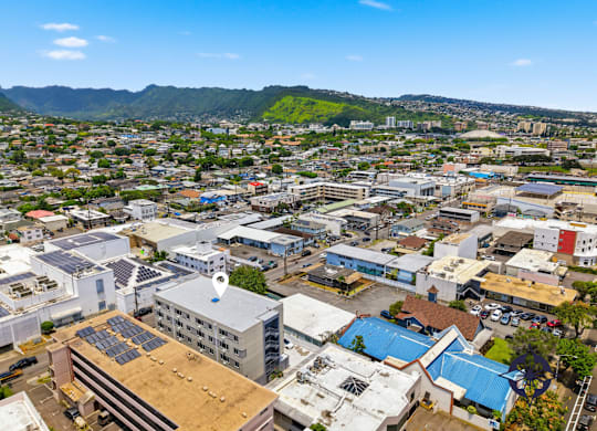 A cityscape with buildings and a clear sky.