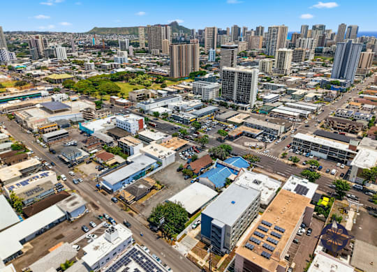 A cityscape with a mix of residential and commercial buildings.