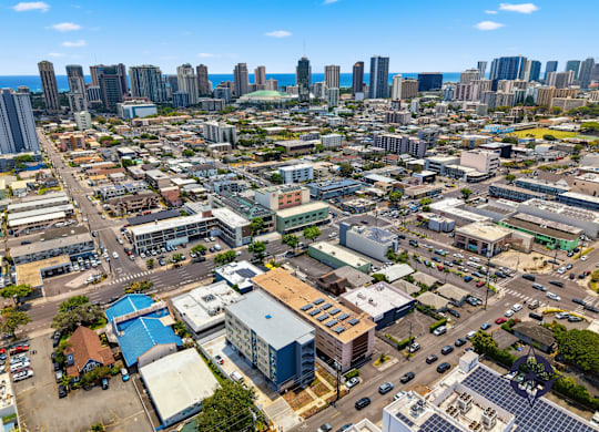 A cityscape with a mix of residential and commercial buildings.
