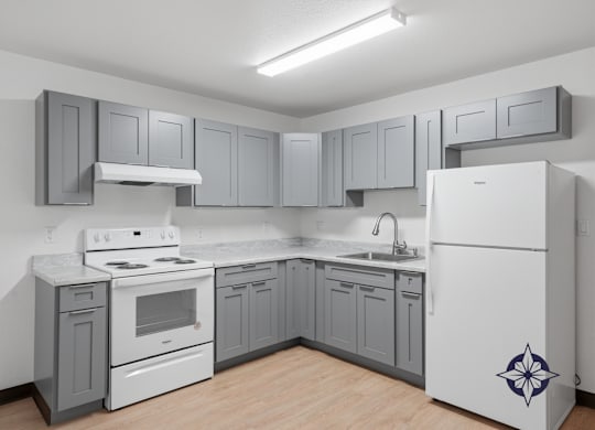 A kitchen with a white fridge and a white stove.