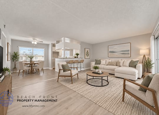 A living room with a couch, chairs, and a coffee table.