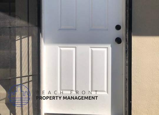 A white door with a number 5 on it.