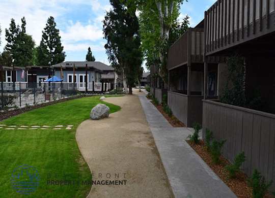 A pathway leads from the foreground to a building in the background.
